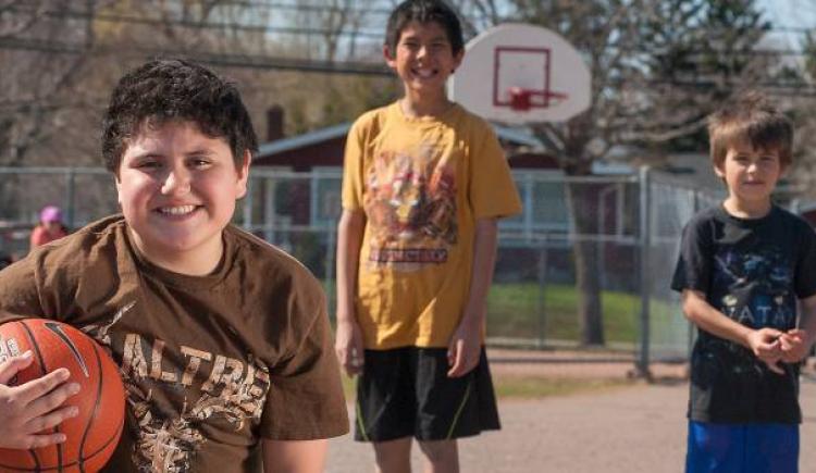 young boys playing basketball