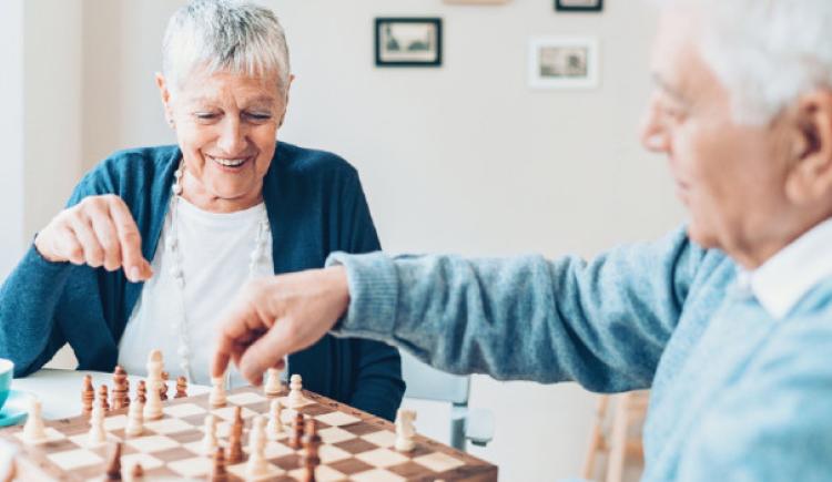 senior couple playing chess